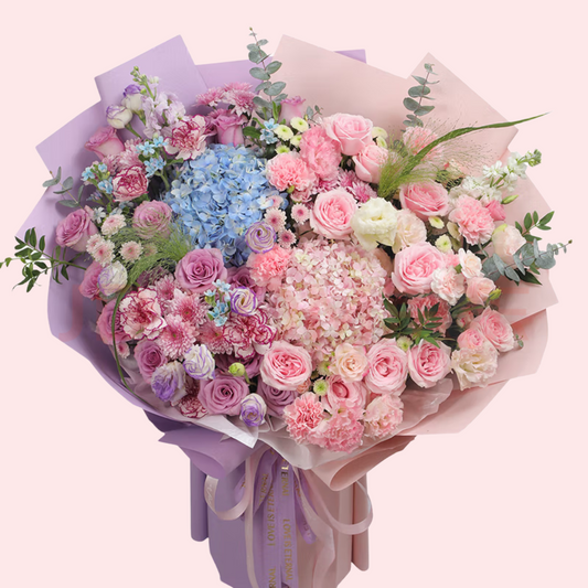 Large bouquet of pink and purple roses, pink and purple carnations, blue and pink hydrangeas and chrysanthemums