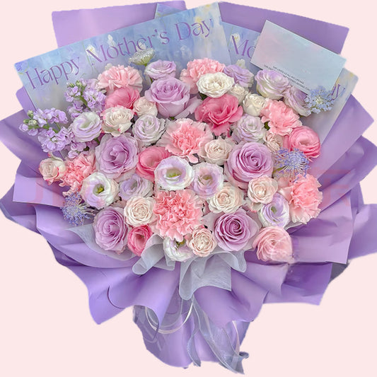 Bouquet of purple, pink and white roses, pink carnations and purple violets