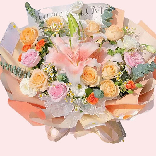 Pink champagne roses with lilies and chamomile bouquet