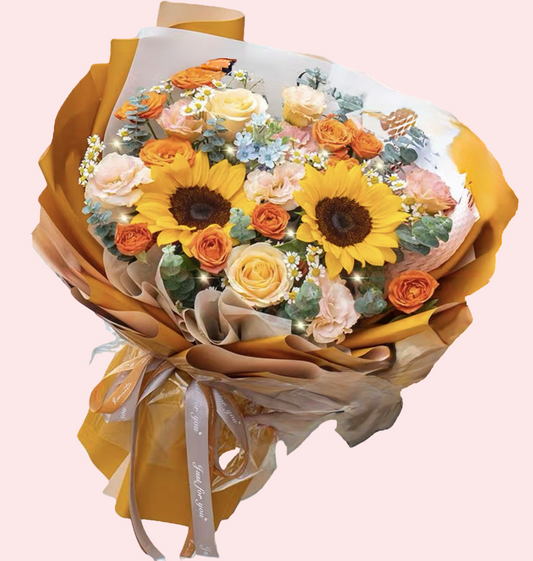Two sunflowers with champagne roses, platycodon, chamomile and orange bubble bouquet
