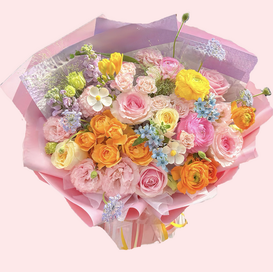 Bouquet of multi-colored roses with lisianthus, blue starflowers, and violets