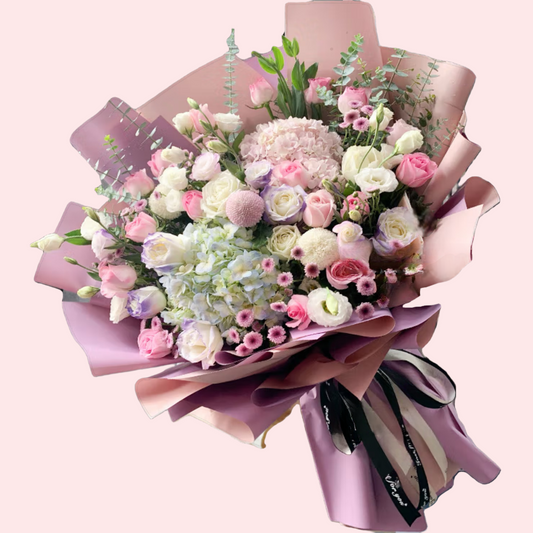 Bouquet of pink roses, hydrangeas with lisianthus, and pink and purple daisies