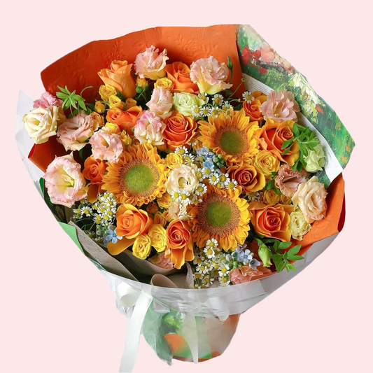 Three heart-shaped sunflowers, orange and yellow roses, pink lisianthus with small blue flowers, chamomile