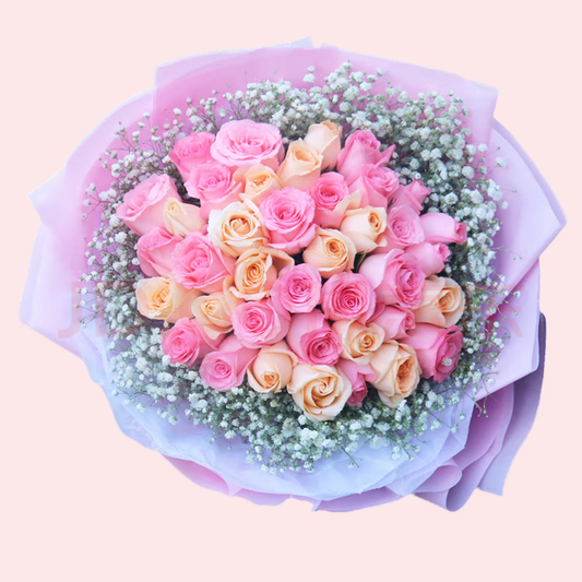 33 pink and champagne mixed roses and baby's breath