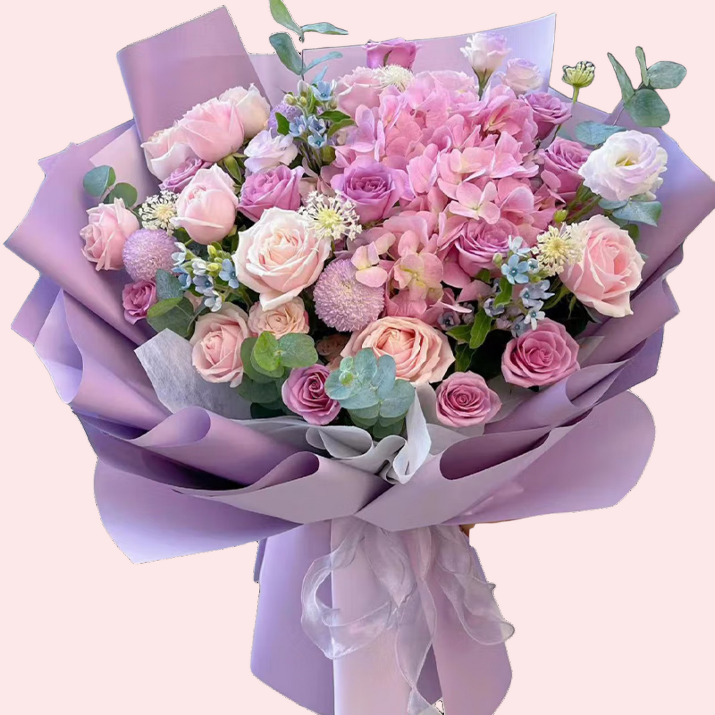 Pink and purple roses with hydrangeas, small blue flowers, and bobblehead daisy bouquet