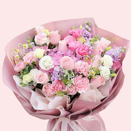 Pink roses, white lisianthus, carnations and chamomile